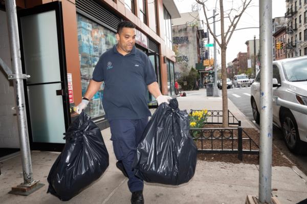 Depending on whether he has early-morning work, Rodriguez faces 14-hour days due to new trash set-out times.