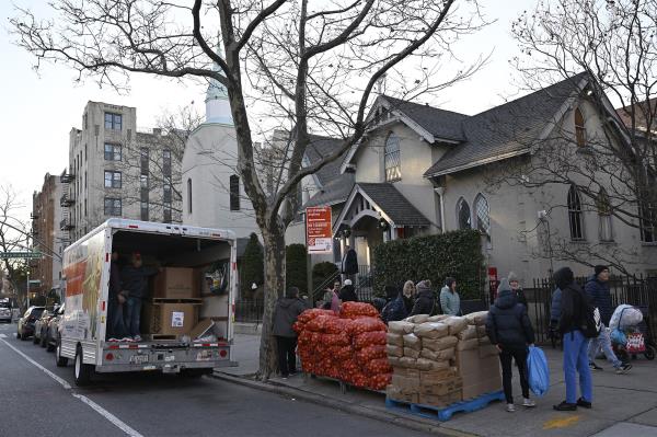 A shipment of food is unloaded in front of Good Shepherd Lutheran Church in Bay Ridge.