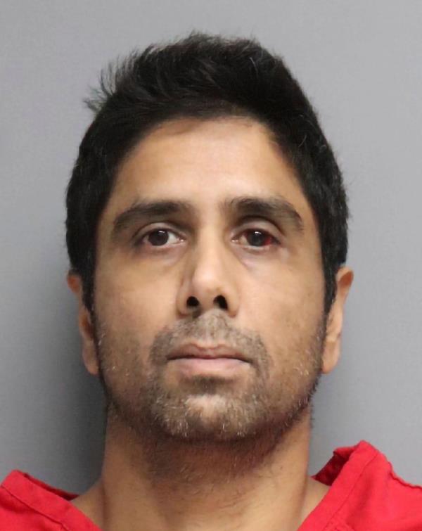 This undated photo provided by the San Mateo County Sheriff's Office shows Dharmesh Patel. Patel the driver of a car that plunged off a treacherous cliff in northern California, seriously injuring himself, his wife and their two young children, has been charged with attempted murder.