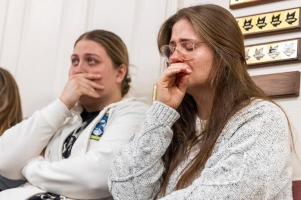 Two women attempt to hold back tears during a press co<em></em>nference a<em></em>bout the murder-suicide in Enoch, Utah on Jan. 5, 2023.