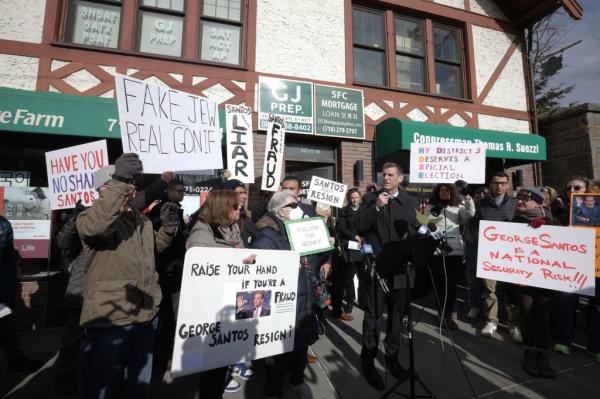 Protesters outside Rep. George Santos' Queens office. 