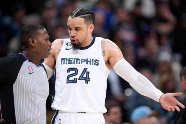 Memphis Grizzlies forward Dillon Brooks, right, talks with referee James Williams during the second half of the team's NBA basketball game against the Denver Nuggets on Friday, March 3, 2023, in Denver.