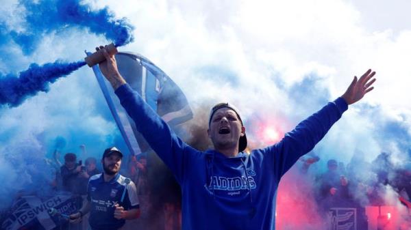 Ipswich fans with flares outside the stadium before the match. Pic: Reuters