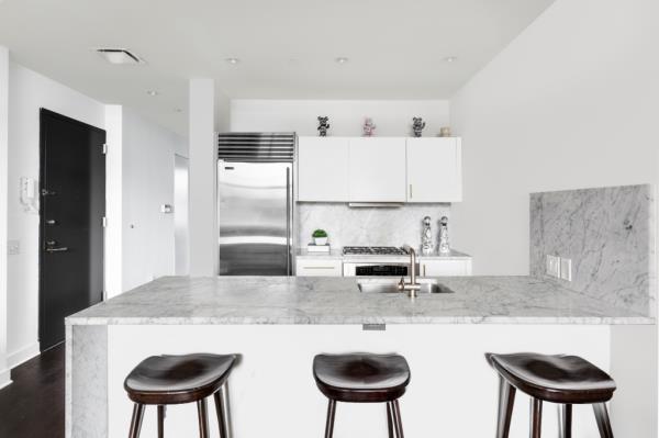 A slick eat-in kitchen inside the downtown abode. 