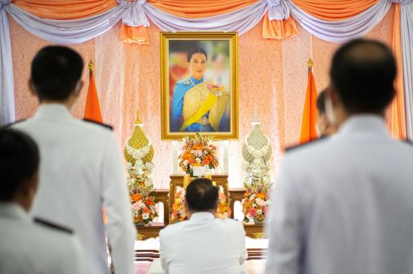 Officials pay their respects in front of a picture of Thailand’s Princess Bajrakitiyabha following her hospitalization.