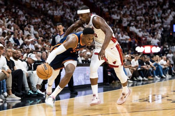 RJ Barrett #9 of the New York Knicks drives past Jimmy Butler #22 of the Miami Heat