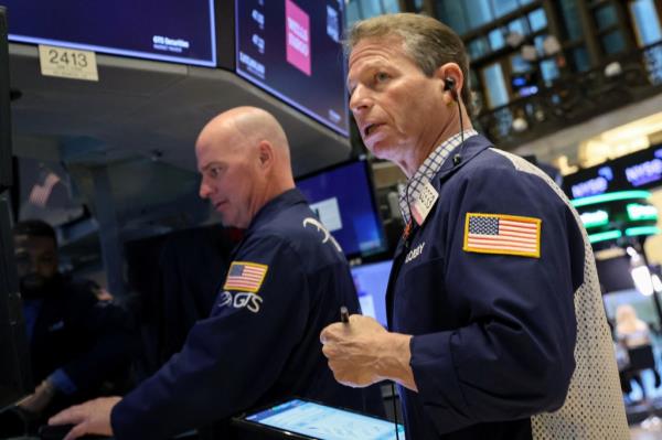 Traders work on the floor of the New York Stock Exchange.