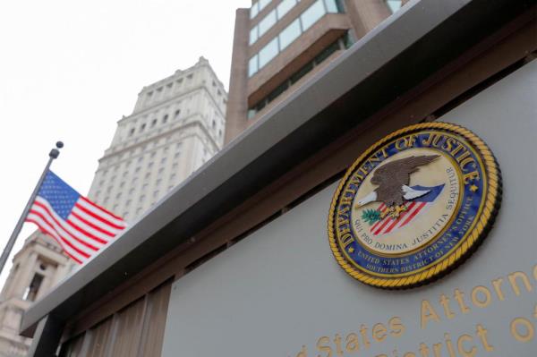 The seal of the United States Department of Justice is seen on the building exterior of the United States Attorney's Office of the Southern District of New York in Manhattan, New York City, U.S., August 17, 2020.