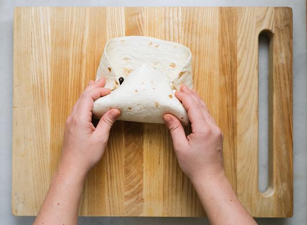 folding the corners of the burrito