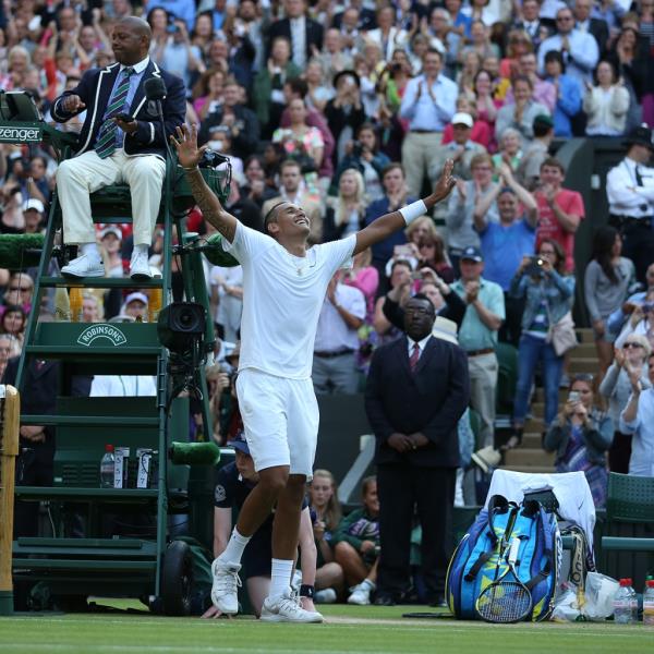 Nick Kyrgios celebrates after defeating Rafael Nadal of Spain during the men's singles fourth round of the Wimbledon Lawn Tennis Champio<em></em>nships at the All England Lawn Tennis and Croquet Club on July 1, 2014 in London, England. 