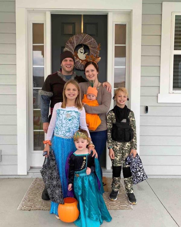 Jared Bridegan poses with his wife, Kirsten, and their children.