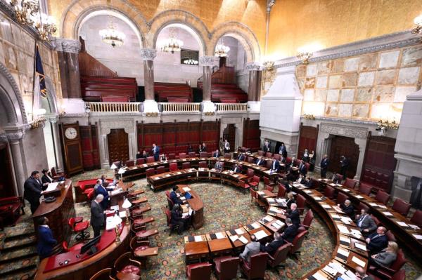 Members of the New York Senate work on legislative bills in the Senate Chamber before Gov. Kathy Hochul presents her executive state budget at the state Capitol on Feb. 1, 2023, in Albany, N.Y.