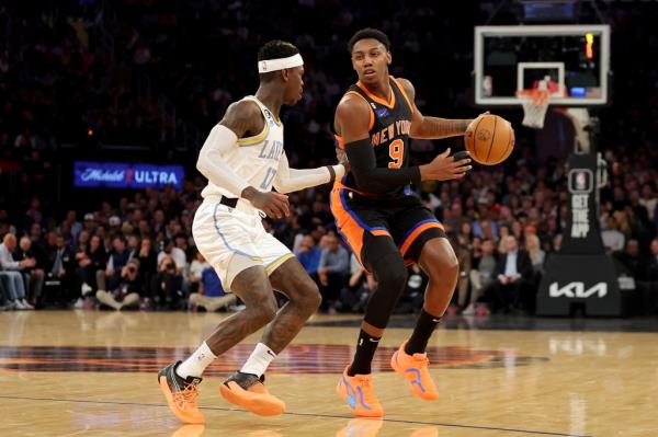 RJ Barrett (9) brings the ball up court against Los Angeles Lakers guard Dennis Schroder (17) during the first quarter at Madison Square Garden. 