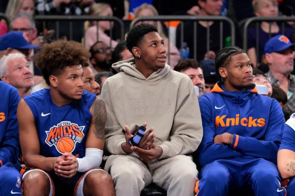 Knicks guard RJ Barrett watches from the bench during a game against the Suns on Jan. 2, 2023 with his finger wrapped up after dislocating it in an earlier game in December.