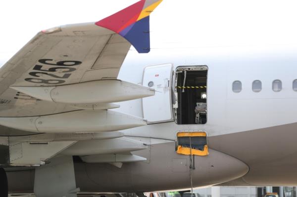 A passenger opened an emergency exit door during a South Korean flight Friday, causing air to gust inside the cabin before the plane landed safely.