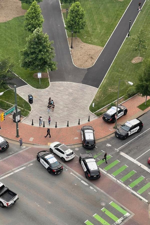 Police vehicles arrive at the scene of a shooting Tuesday, June 6, 2023.