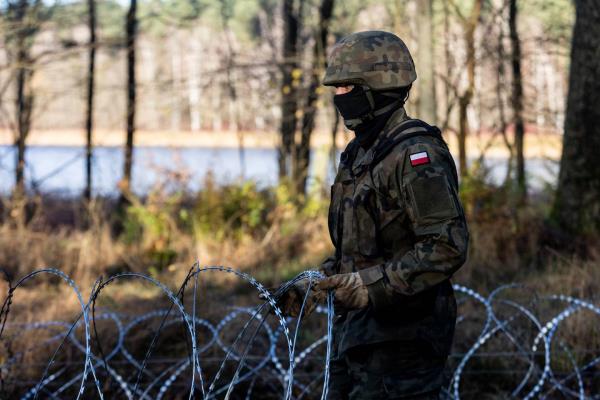 Soldiers of the Polish army install co<em></em>ncertina wire at Poland's border with Russian exclave Kaliningrad on November 14, 2022 in Goldap, Poland. 