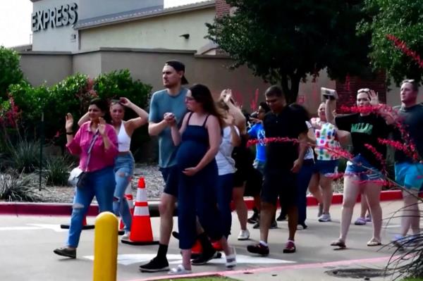 Shoppers were quickly guided out of the mall in the aftermath of the shooting. 