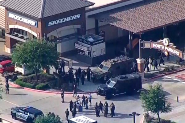 Police respond to a shooting in the Dallas area's Allen Premium Outlets.