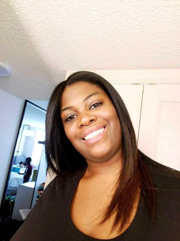 Ajike Owens, 35, was shot and killed through her neighbor's front door on Friday.