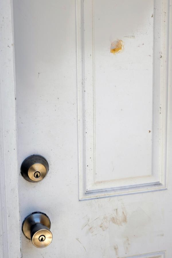 A patched bullet hole, upper right, is seen on a door wher<em></em>e Ajike Owens, a 35-year-old mother of four, was shot and killed 