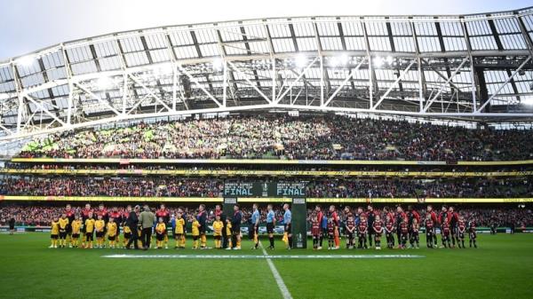 Players line up for Amhrán na bhFiann in front of a record FAI Cup final attendance at the Aviva Stadium