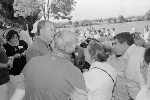 Schiff surrounded by people listening to him