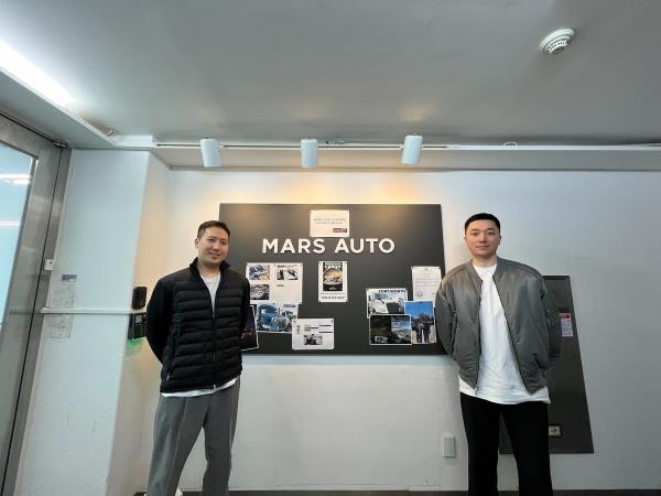 Park Il-su (R), CEO of Mars Auto, and Roh Jae-kyung, COO of the company, pose for a photo at their office in southern Seoul on Dec. 11, 2023. (Yonhap)