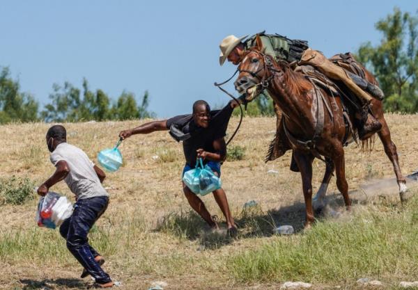 A United States Border Patrol agent on horseback tries to stop a Haitian migrant from entering an encampment on the banks of the Rio Grande near the Acuna Del Rio Internatio<em></em>nal Bridge in Del Rio, Texas on Sep. 20, 2021. 