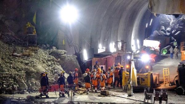 Members of the Natio<em></em>nal Disaster Respo<em></em>nse Force (NDRF) enter a tunnel wher<em></em>e workers have been trapped for ten days after it collapsed