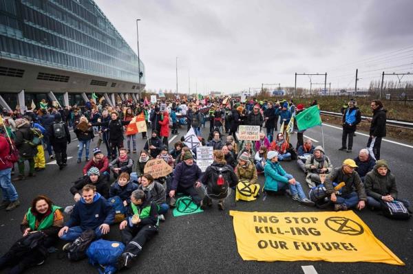 Climate activists block Amsterdam highway in protest against ING