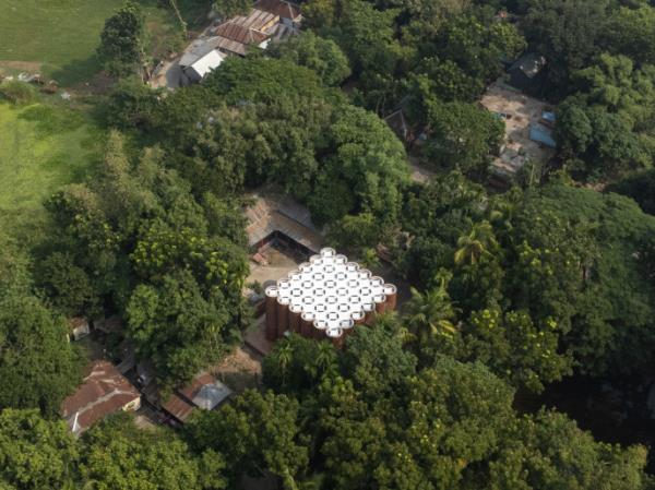 Surrounded by lush greenery and a tranquil pond, the verdant trees provide a natural canopy, casting dappled shadows all around. Photo: Courtesy 