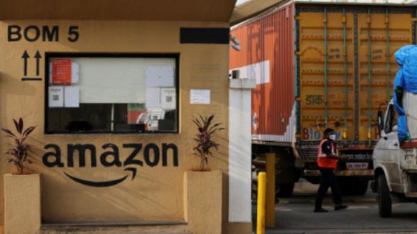 A man inspects trucks before they enter an Amazon storage facility on the outskirts of Mumbai, India, October 1, 2021. REUTERS/Francis Mascarenhas/File Photo