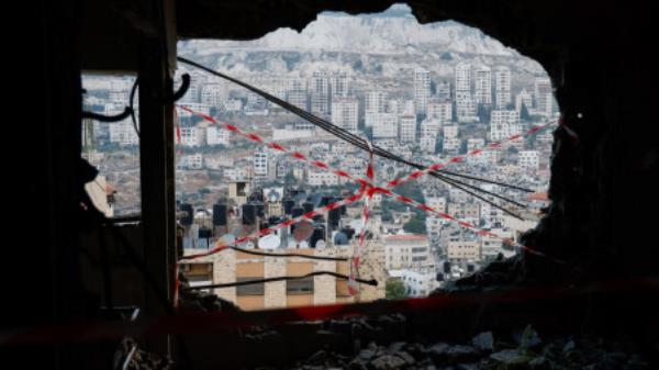 A view from inside a house demolished by the Israeli army in Nablus, in the Israeli-occupied West Bank, June 15, 2023. REUTERS/Raneen Sawafta</p>

<p>　　