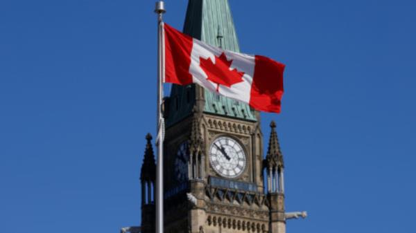 A Canadian flag flies in front of the Peace Tower on Parliament Hill in Ottawa, Ontario, Canada, March 22, 2017. REUTERS/Chris Wattie