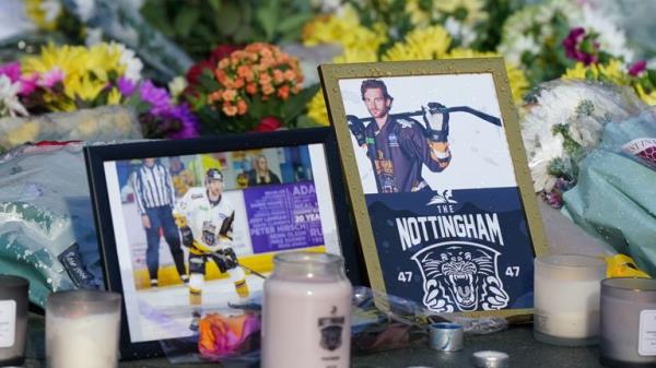 Lit candles among the flowers and messages left in tribute to Nottingham Panthers' ice hockey player Adam Johnson outside the Motorpoint Arena in Nottingham, the home of the Panthers. Mr Johnson died after an accident during a Challenge Cup match with Sheffield Steelers on Saturday night. Picture date: Mo<em></em>nday October 30, 2023.