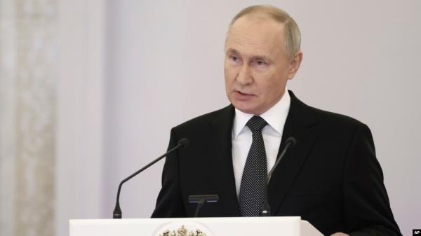 Russian President Vladimir Putin delivers a speech at the St. George Hall of the Grand Kremlin Palace in Moscow, Dec. 8, 2023. The announcement comes a day after lawmakers set the election date.