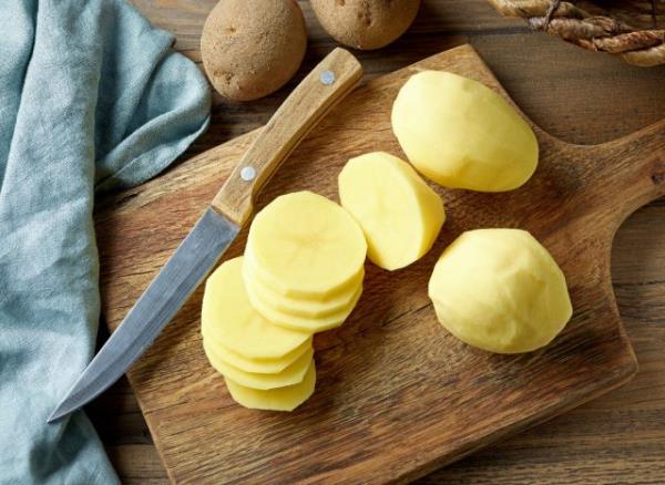 potato slices on cutting board