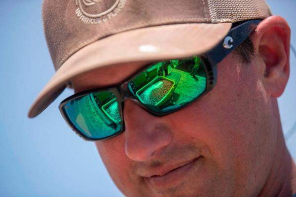 Seed peanuts are reflected in the glasses of farmer Do<em></em>nny Lassiter as they are loaded into planting equipment on Friday, May 12, 2023 in Pendleton, N.C. Lassiter grows more than 1,500 acres of peanuts in an around Northampton County, North Carolina.