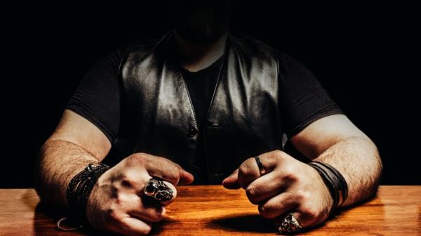 Biker sitting in shadow