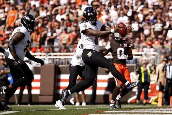 Baltimore Ravens quarterback Lamar Jackson (8) scores a touchdown during an NFL football game against the Cleveland Browns, Sunday, Oct. 1, 2023, in Cleveland. (AP Photo/Kirk Irwin)