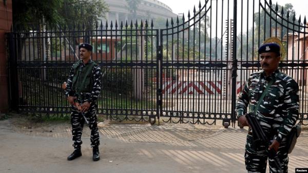 FILE - Security force perso<em></em>nnel stand guard outside the parliament premises after a man jumped into the lawmakers' area of the lower house of India's parliament, in New Delhi, India, Dec. 13, 2023. 