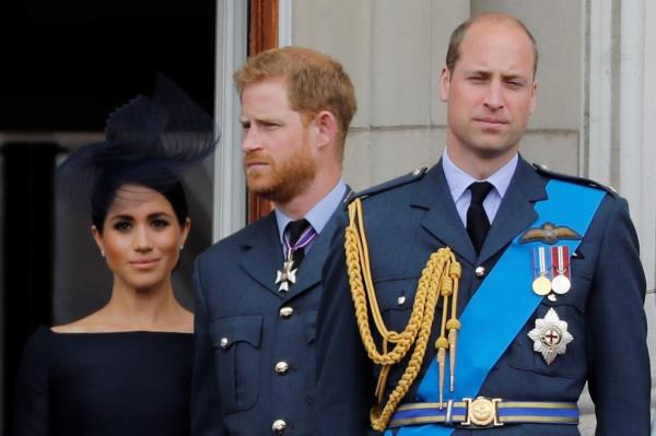 Britain's Meghan, Duchess of Sussex, Britain's Prince Harry, Duke of Sussex, Prince William and Princess Kate take a walk at Windsor.