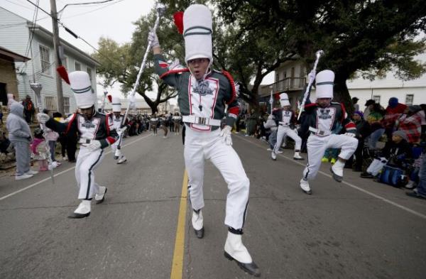 Drum majors from the Mississippi Valley State University marching band parade down Jackson Ave during the traditio<em></em>nal Krewe of Zulu Parade on Mardi Gras Day in New Orleans, Tuesday, Feb. 13, 2024. (AP Photo/Matthew Hinton)