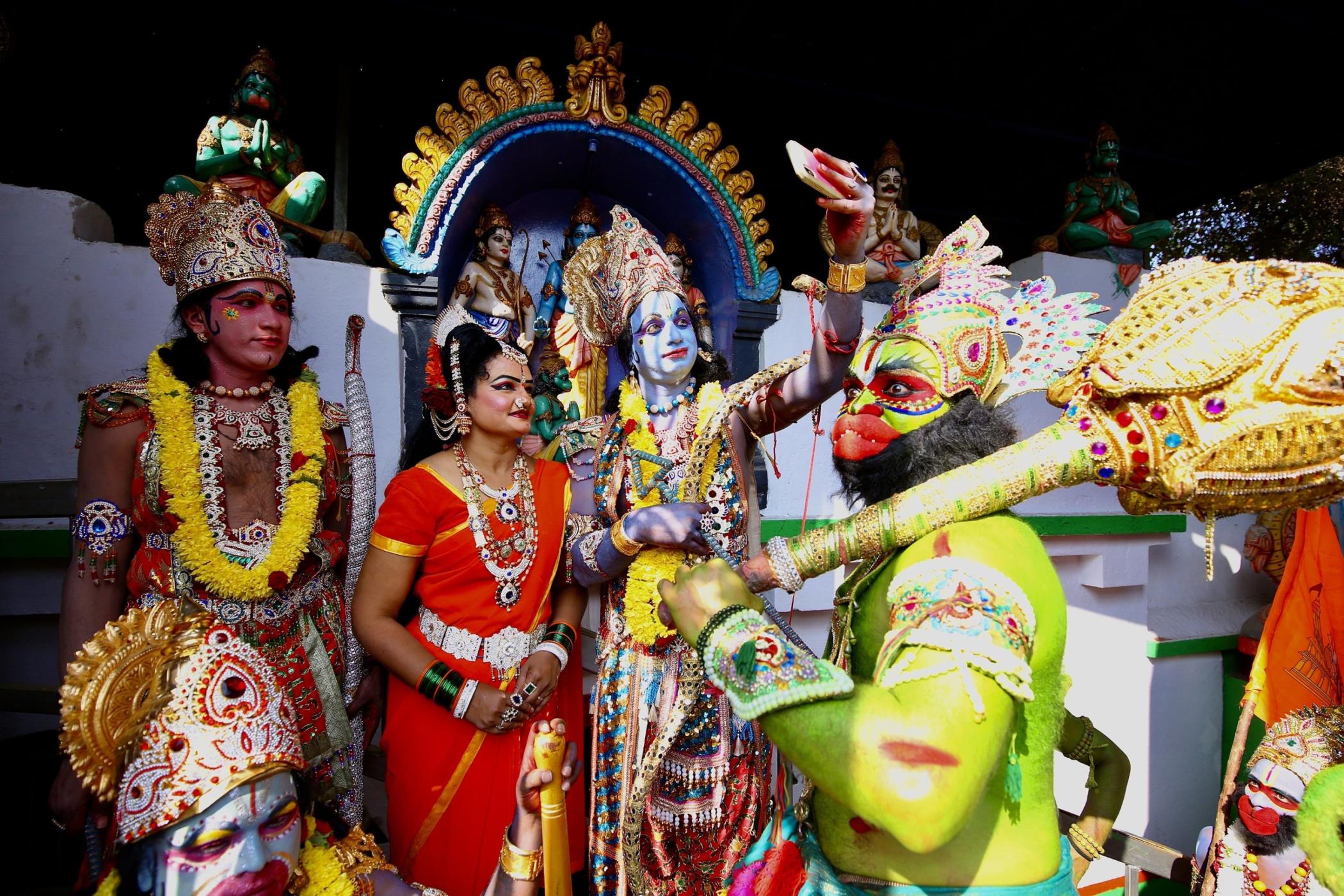 Indian folk artists attired like Rama, Sita, Laxmana and Hanuman perform at the inaugural ceremony of the Ayodhya Lord Ram Temple, Bengaluru, India, Jan. 22, 2024. (EPA Photo)