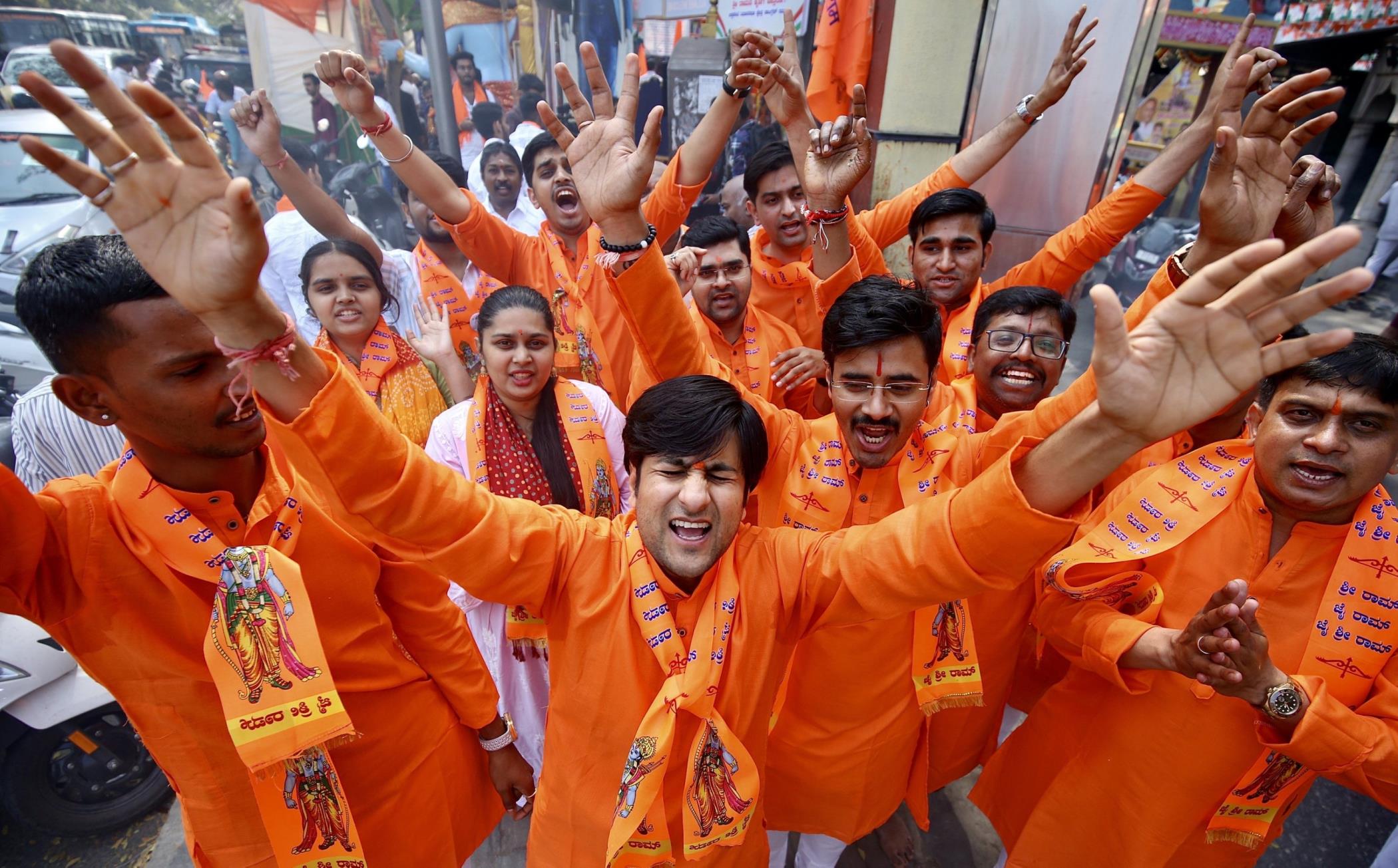 Hindu devotees chant as they watch the live coverage of the inaugural ceremony of the Ayodhya Lord Ram Temple, Bengaluru, India, Jan. 22, 2024. (EPA Photo)