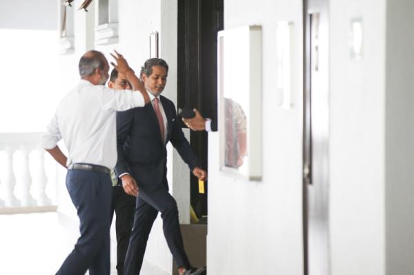 Before the trial started this morning, former Umno Youth chief Khairy Jamaluddin was seen chatting with Datuk Seri Najib Razak while seated beside him in the public gallery in the courtroom. — Picture by Ahmad Zamzahuri