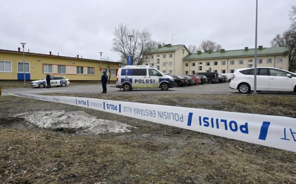 Finnish police officers guard the scene behind police tapes at the primary Viertola comprehensive school wher<em></em>e a child opened fire and injured three other children, on April 2, 2024 in Vantaa, outside the Finnish capital Helsinki. Police said, that the attacker was in custody, and 