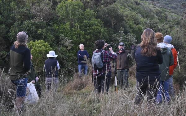 Tim Park (centre with hat) sharing Long Gully Bush Reserve's history with trustees.