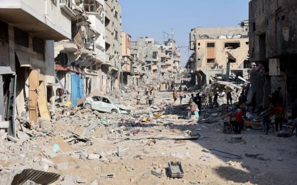 A view of the destroyed buildings and rubble after the Israeli military withdrew from the Shujaiya neighbourhood, east of Gaza City on July 10, 2024, amid the o<em></em>ngoing co<em></em>nflict between Israel and the militant Hamas group. Israel's army dropped thousands of leaflets over war-torn Gaza City on July 10, urging all residents to flee a heavy offensive through the main city of the besieged Palestinian territory.